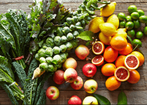 a group of fruits and vegetables on a wood surface Healthy Weight Loss Diets Boston